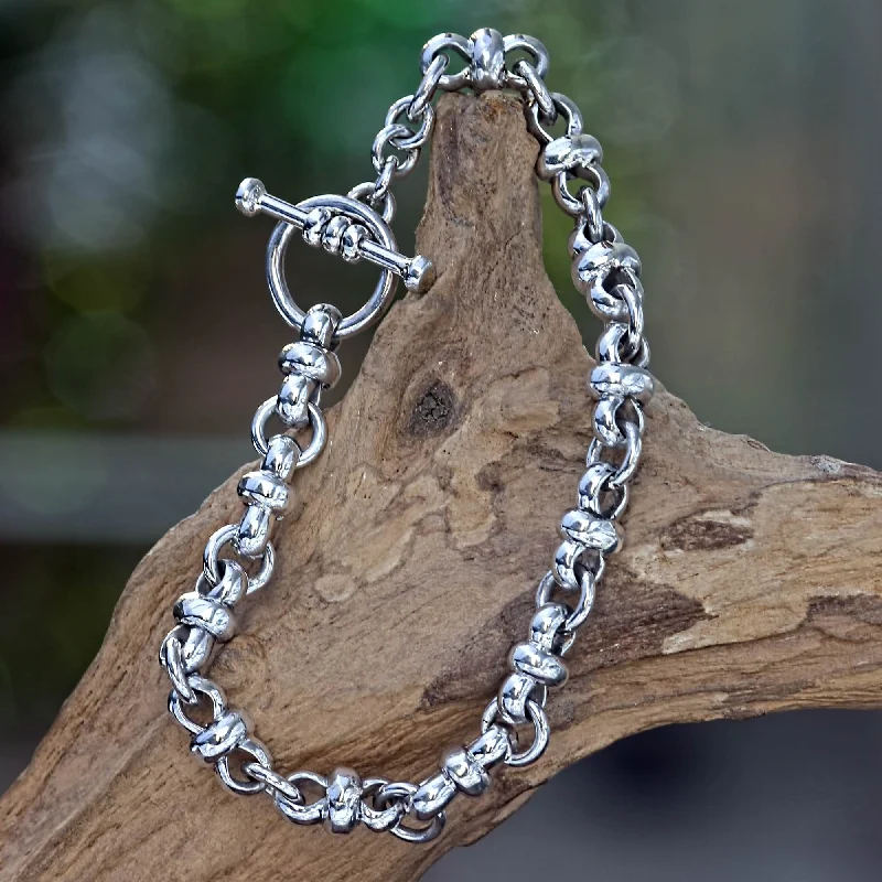 Eight Motif Sterling Silver Link Bracelet